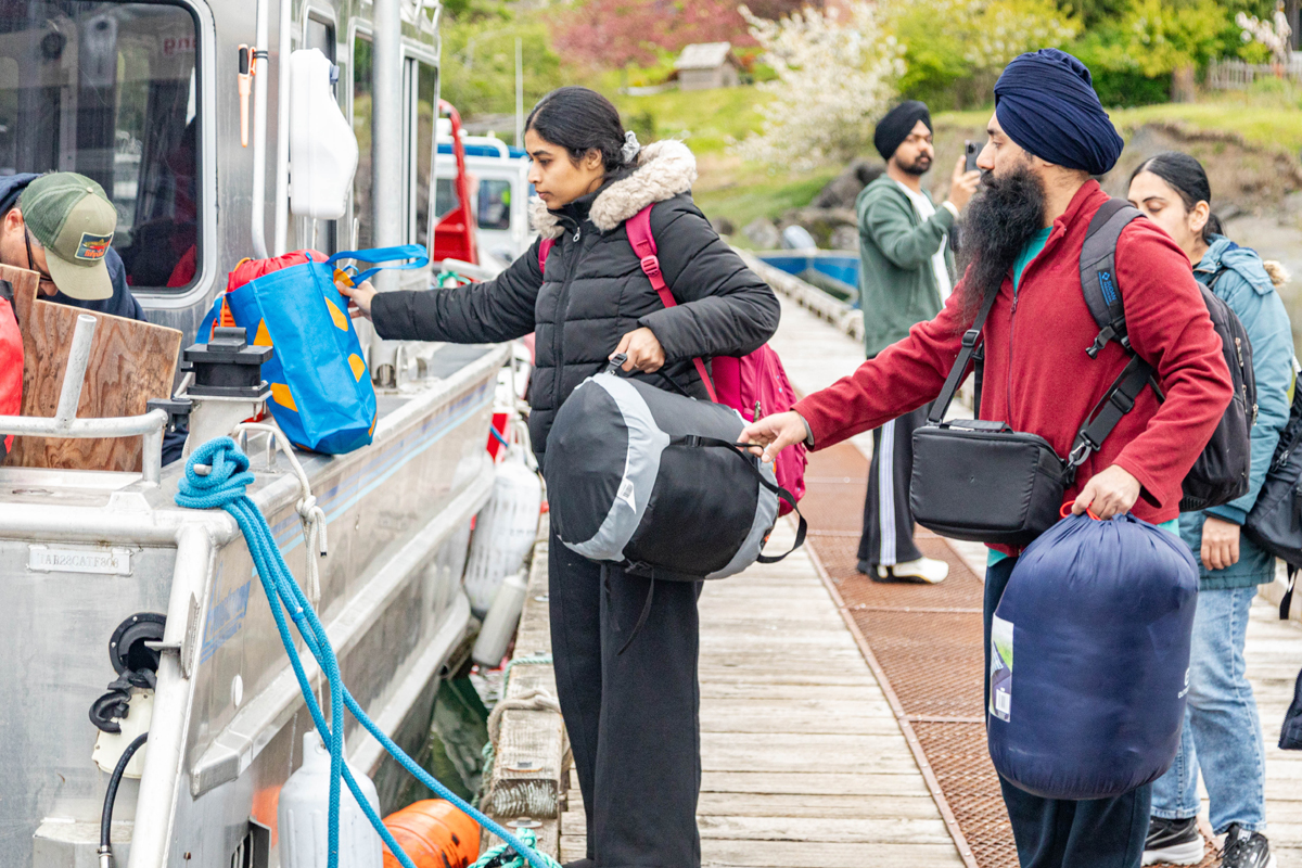 Students loading the Haida Style boat.