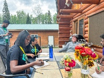 Students interview a local farmer.