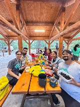 The marketing field school class enjoys a hearty meal at their campsite.